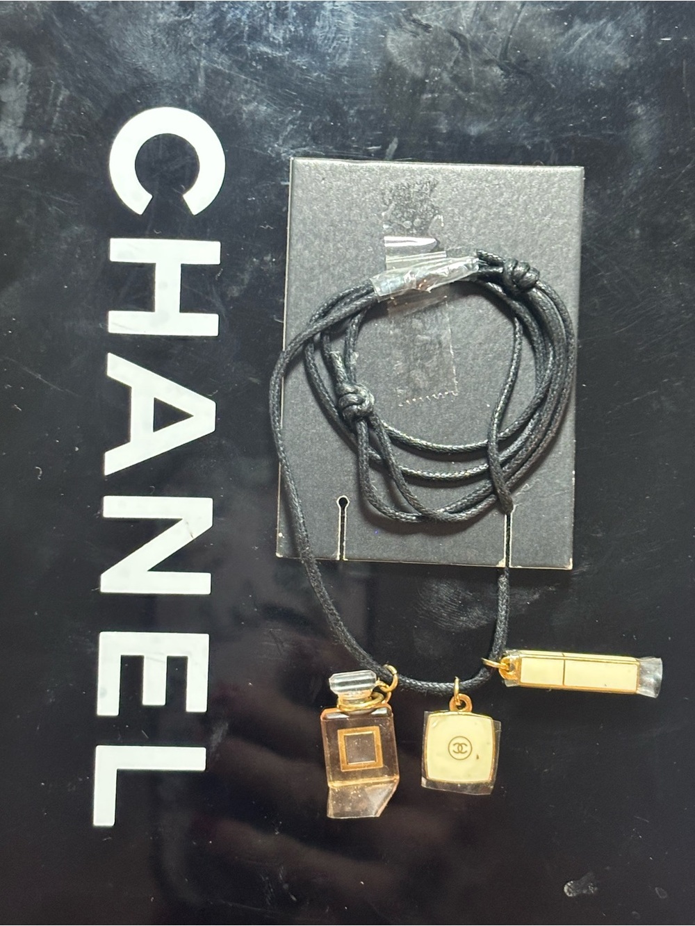 CHANEL Black Cord Necklace with Gold Perfume Bottle & Lipstick Charms